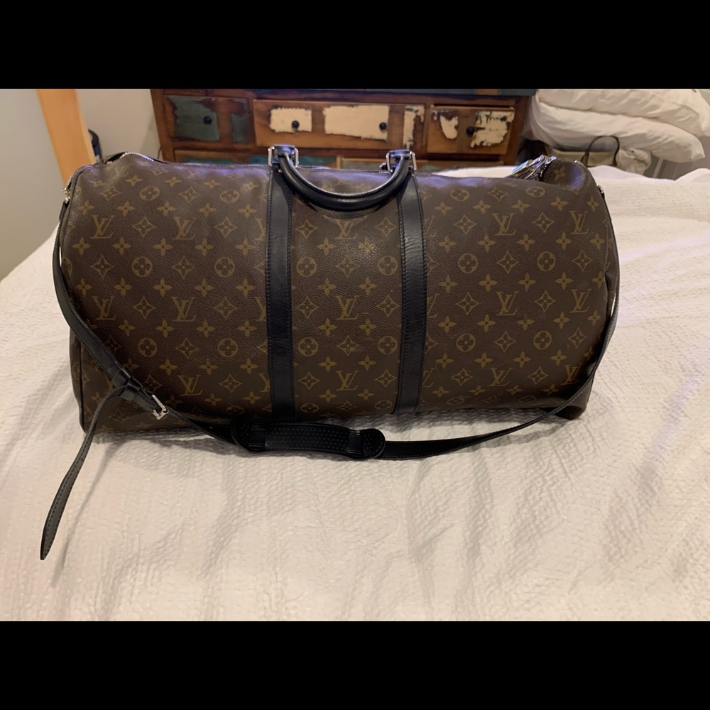 Never used Louis Vuitton keepall bandouliere 55